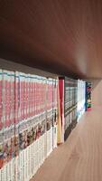 A shelf with a bunch of books on it photo