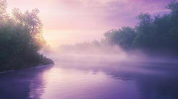 A serene river landscape at dawn, enveloped in mist and soft purple hues. photo
