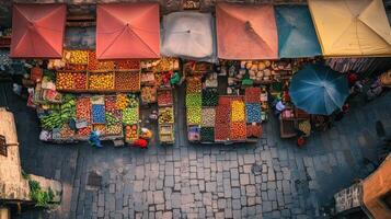 A vibrant market scene showcasing an array of fruits and vegetables under colorful canopies photo