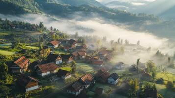 Aerial view of a serene village surrounded by misty mountains and lush greenery. photo