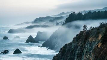 Misty coastal landscape with rocky cliffs and waves crashing against the shore. photo