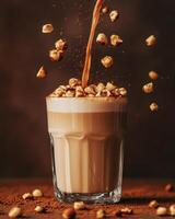 A glass of creamy beverage topped with scattered popcorn and cocoa powder. photo