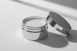 A metallic container with a removable lid, likely used for cream or skincare products photo