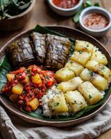 A vibrant plate of assorted dishes featuring rice, plantains, and a spicy vegetable stew. photo