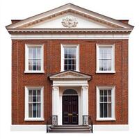 A classic brick building featuring a symmetrical facade with white accents and a central entrance. photo