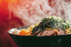 A steaming bowl of ramen sits on a table, topped with sliced meat, green onions, and nori. The rich broth and warm steam create an inviting atmosphere, perfect for enjoying a hearty meal. photo