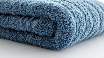 Blue Folded Towel on White Background photo