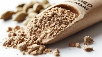 Cinnamon powder and cardamom seeds photo