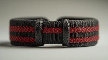 Closeup of a Black and Red Braided Watch Strap photo