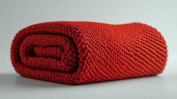 Close-Up of a Rolled Red Knit Blanket photo