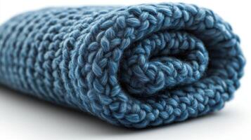 Close-Up of a Rolled Blue Knitted Fabric photo