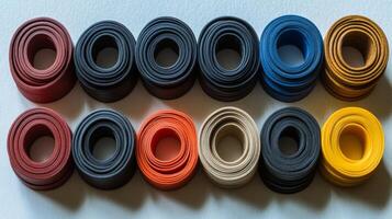 Colorful Rolled Leather Rings Arranged in Rows photo