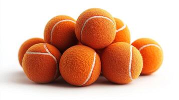 Orange Tennis Balls Stacked on White Background photo