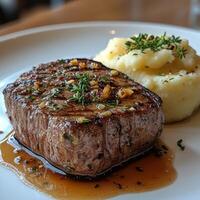 Juicy Grilled Steak with Creamy Mashed Potatoes and Fresh Herbs photo