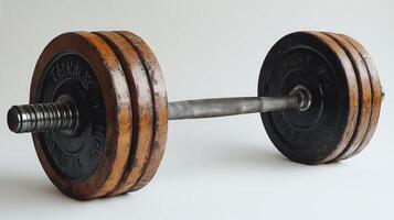 Vintage Wooden Dumbbell on White Background photo