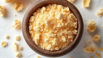 Dried Egg Yolk Powder in a Wooden Bowl photo