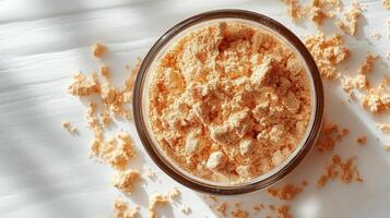 Close Up of a Glass Jar Filled with Yellow Powder photo