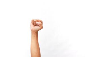Raised fist gesture symbolizing strength, unity, and empowerment on white photo