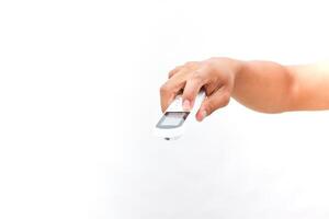 Hand Using a Remote Control for Temperature Adjustment photo
