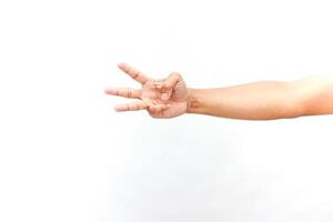 Isolated hand gesturing number three, against simple white background photo