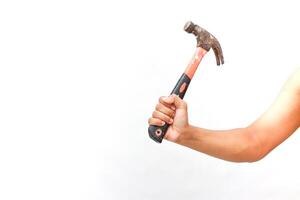 Strong arm wielding rusty hammer, demonstrating hand tool usage on white background photo