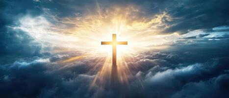 A cross is shining in the sky above clouds photo