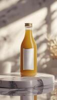 Elegant glass bottle of amber liquid on a marble surface with sunlight creating shadows in the background. Product display. photo