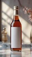 Elegant glass bottle with a golden top, presented on a marble surface, reflecting sophistication and understated product presentation. photo
