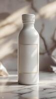 An elegant white container on marble with delicate gold trim, blending sophistication with a minimalist aesthetic. Pure product showcase. photo