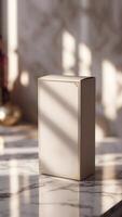 Elegant packaging box on a reflective surface, bathed in warm light, suggesting luxury and attention to detail. Refined design. photo