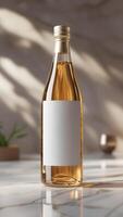 Elegant bottle with a blank label stands on a marble surface, sunlight creating a soft, inviting ambiance for product promotion. photo