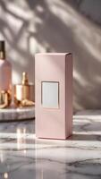 Elegant presentation of a pastel pink box with a golden framed label, paired with complementary cosmetics on a luxurious marble surface. photo