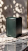 Elegant green product box with gold trim, sitting on a luxurious marble surface with soft light and shadow patterns playing in the background. photo