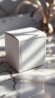 Elegant presentation. square box with gold accents sits on marble surface, bathed in sunlight, showcasing minimalist sophistication and refined design. photo