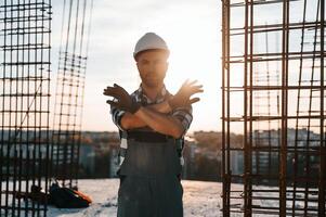 Restricted,, area. No trespassing. Man is working on the construction site at daytime photo