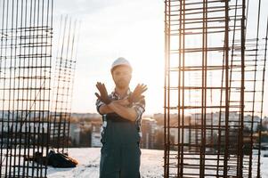 Restricted area. No trespassing. Man is working on ,the construction site at daytime photo