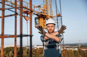 Restricted ,area. No trespassing. Man is working on the construction site at daytime photo