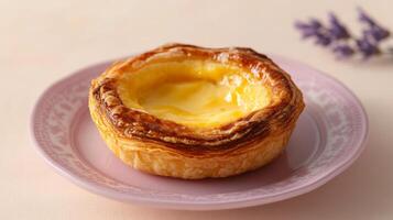 Golden Custard Tart on Lavender Colored Plate photo