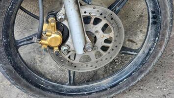 a close up of a motorcycle wheel with a brake photo