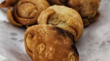 a close up of some fried doughnuts photo