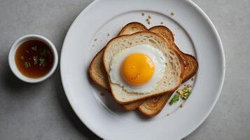 Delicious Fried Egg on Toast with Broth for a Nutritious Breakfast photo