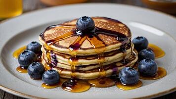 Delicious Blueberry Pancakes Stack with Maple Syrup Drizzle, perfect for breakfast or brunch indulgence photo