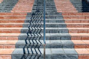 an abstract image of a staircase covered in coloured flint tiles photo