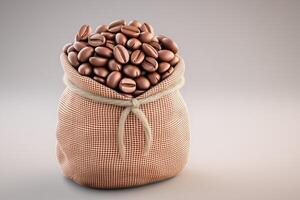 Roasted coffee beans overflowing from small burlap sack on gray background photo
