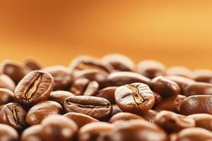 Roasted coffee beans creating textured background with warm orange gradient, with copy space photo