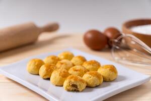 Traditional nastar cookies on a square white plate photo