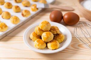 Traditional nastar cookies on a round white plate background photo