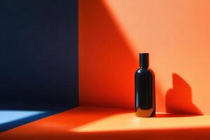 Black Bottle with Cap on an Orange and Blue Surface photo