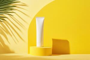White Tube Cosmetic Product on Yellow Platform with Palm Leaf Shadow photo
