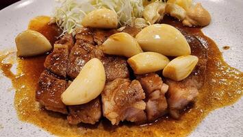 Delicious Garlic Pork Dish with Tender Meat and Creamy Sauce photo